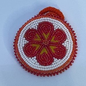 Handmade Alaska Native Beaded hair tie with orange and white and yellow beads
